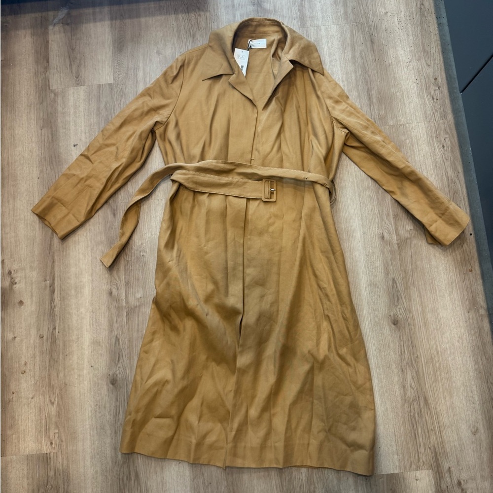 The Row tan rundi trench coat.